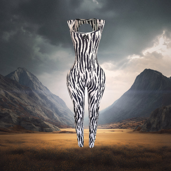 Zebra-striped jumpsuit in a mountainous landscape