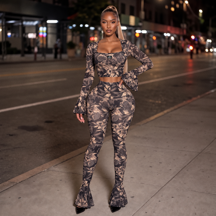 Midnight Kiss Mesh Set front view - see-through mesh crop top with purple floral print, square neckline and bell sleeves, worn with matching high-waisted flare pants
