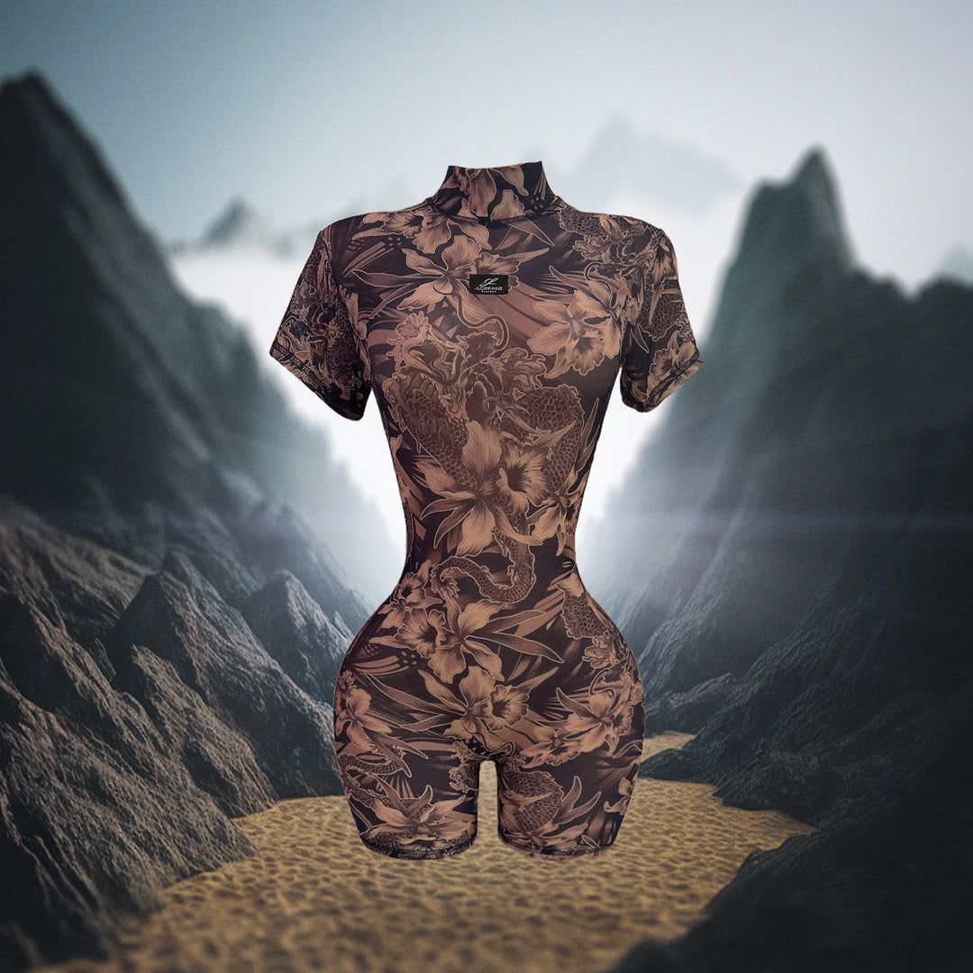 Patterned bodysuit on a mannequin against a mountainous landscape