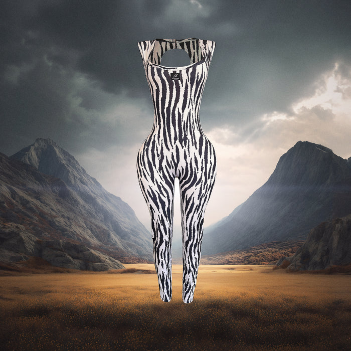 Zebra-striped jumpsuit in a mountainous landscape
