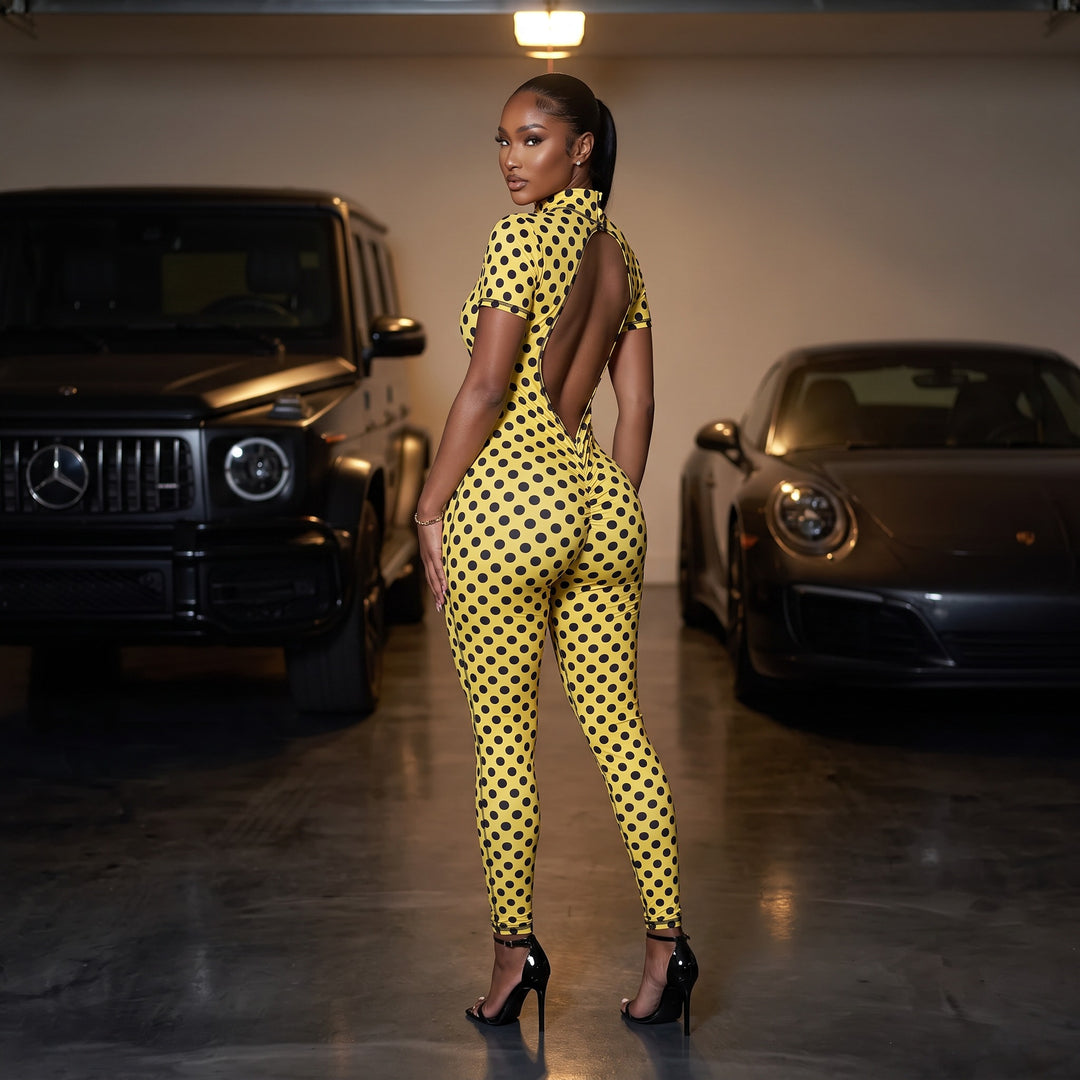 Model wearing the Sanity Jumpsuit in yellow polka dot - open back view