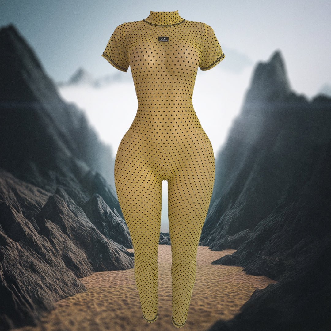 Yellow bodysuit with black polka dots on a mountainous landscape