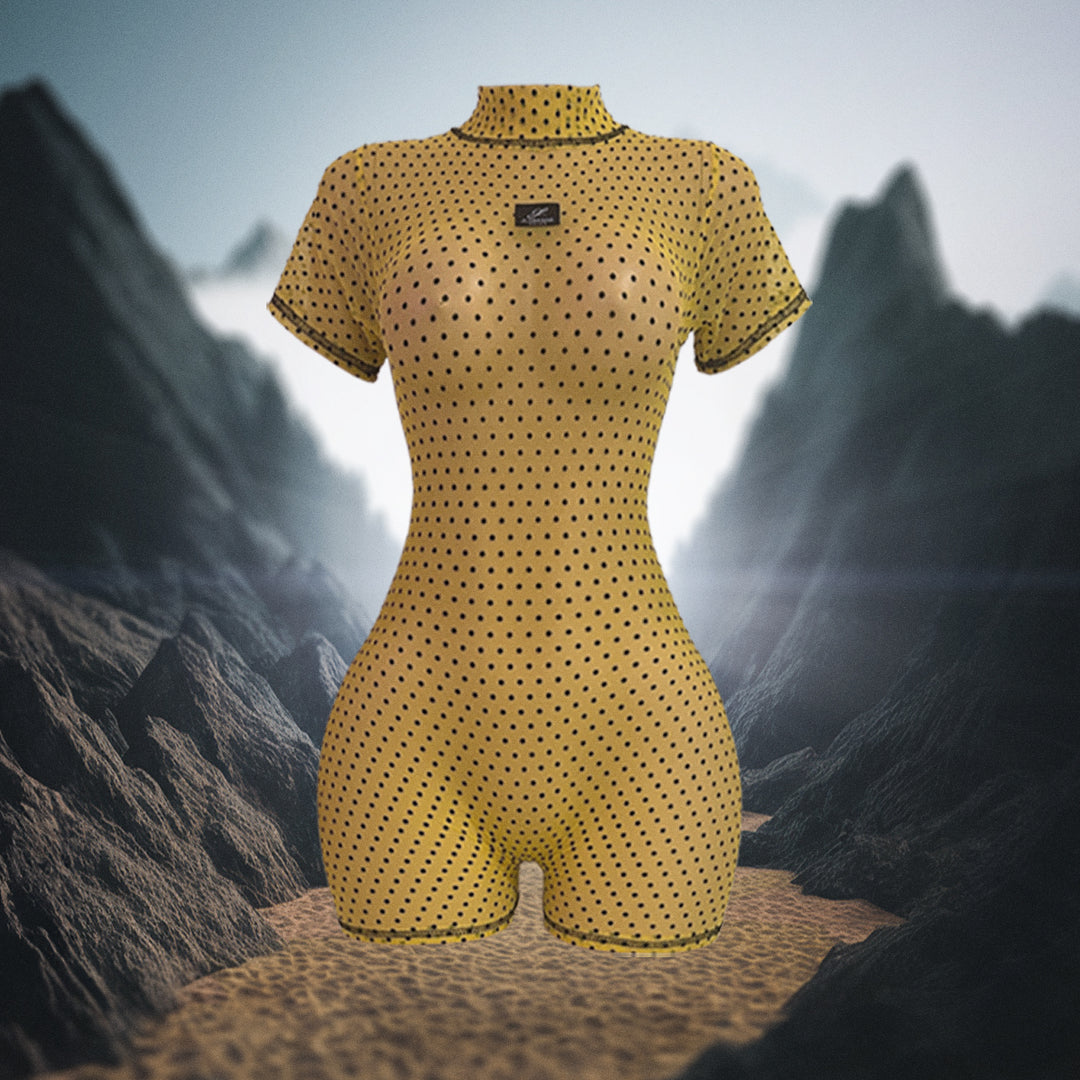 Yellow polka dot swimsuit on a mannequin against a mountainous background